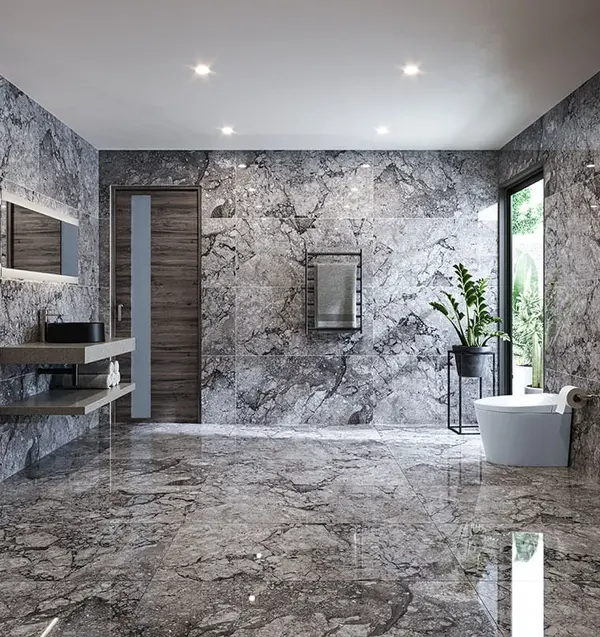 Baño revestido en piedra gris